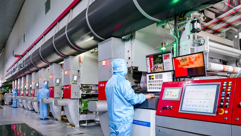 workers on flexible pacakage production line